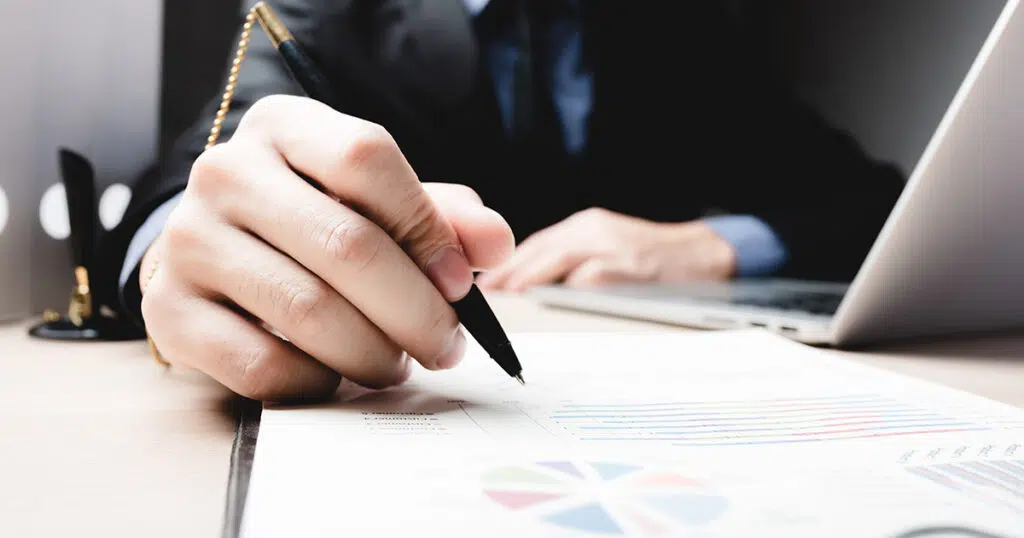 Person signing contract during notary service