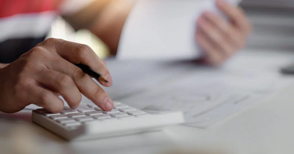 Bookkeeping professional inputting business receipts